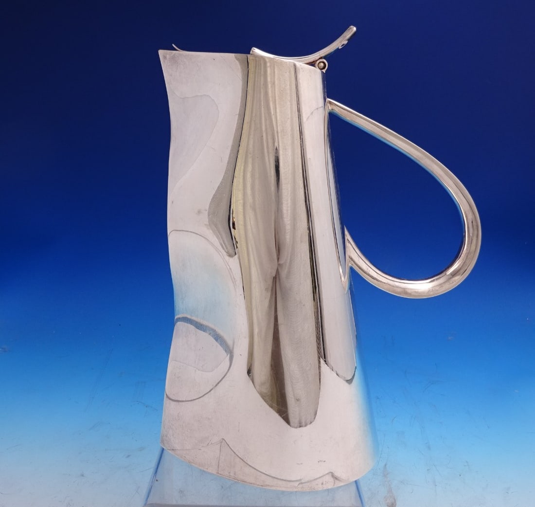 Sterling Silver Sangria Pitcher by Ravissant Modernist India 10 Inch: Sterling Silver Sangria Pitcher by Ravissant Modernist India 10 Inch This modernist sterling silver sangria pitcher by Ravissant of India features a sleek and elegant design. Measuring 10 inches in he