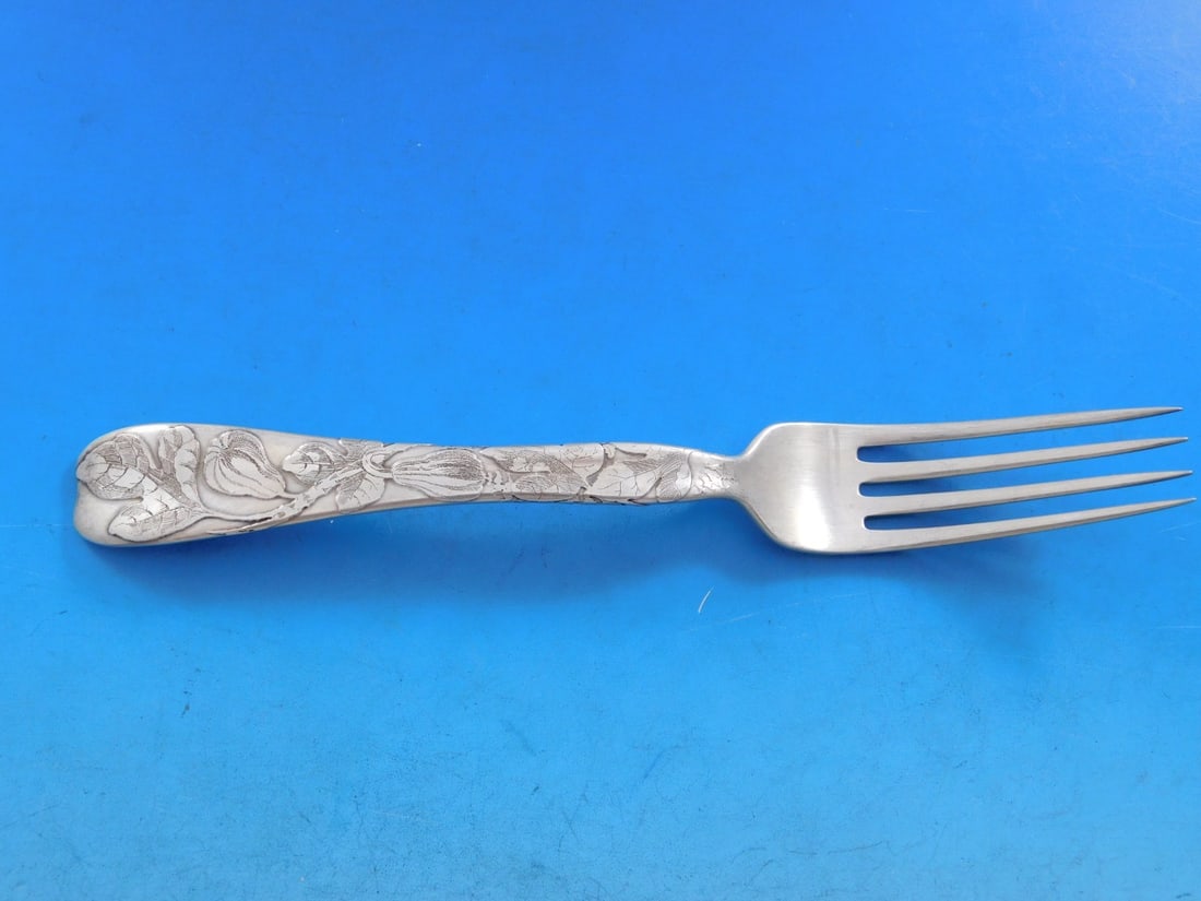 Tiffany & Co. Lap Over Edge Sterling Silver Fork 7 1/4" Figs Motif: Tiffany & Co. Lap Over Edge Sterling Silver Fork 7 1/4" Figs Motif This exquisite sterling silver fork from Tiffany & Co. features the elegant Lap Over Edge pattern with a delicate fig motif. Measurin