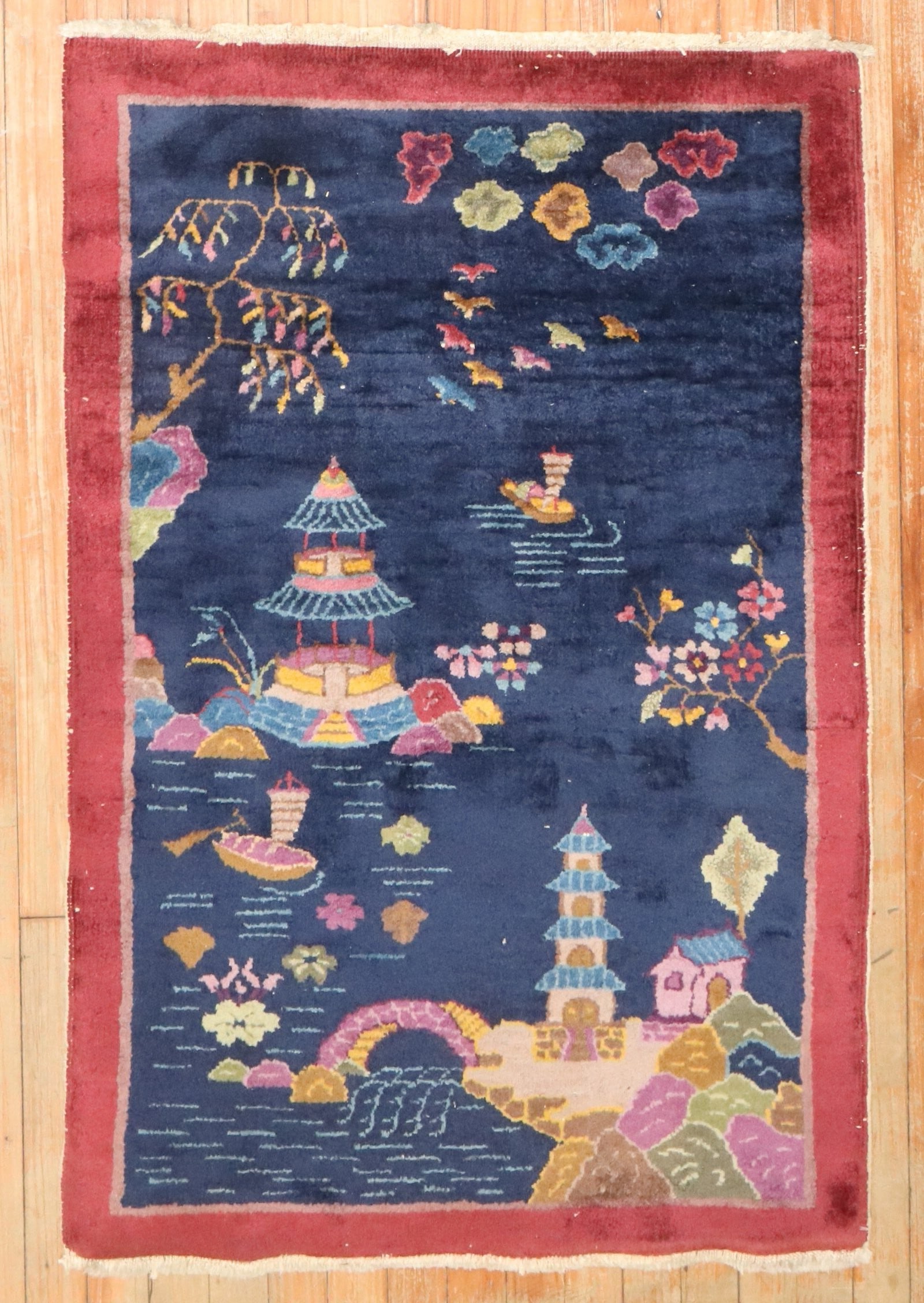 2' 7" x 4' 11" Chinese Deco Small Rug Blue 1930s: 2' 7" x 4' 11" Chinese Deco Small Rug Blue 1930s A pre-owned 1930s Chinese Art Deco rug in a small size. The design features a dark blue field with a scenic landscape motif including pagodas, trees, b