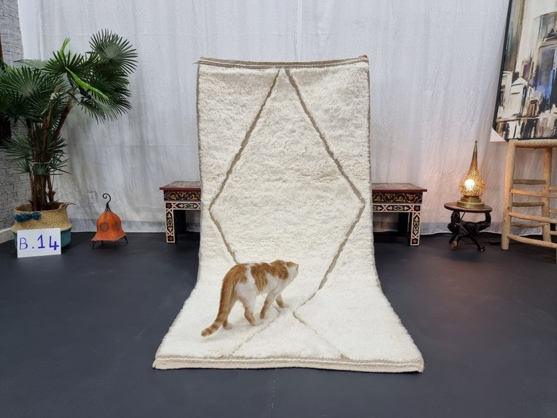Handmade Moroccan Berber Wool Rug Soft White Engraved Pattern 3.28 x 6.56 Feet: Handmade Moroccan Berber Wool Rug Soft White Engraved Pattern 3.28 x 6.56 Feet Experience the elegance of this stunning soft white handmade Moroccan Berber wool area rug, featuring a beautifully engra