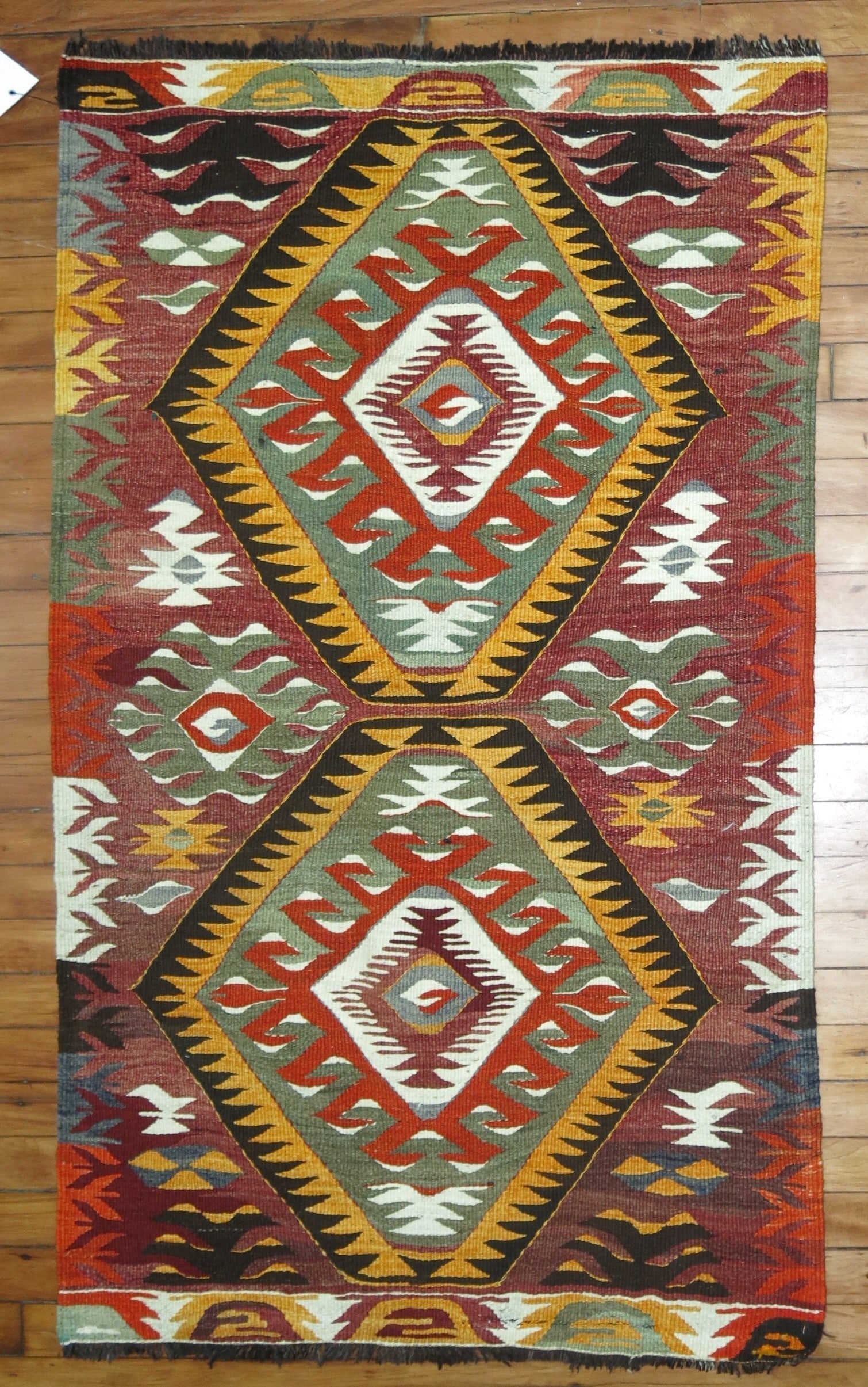 2' 6" x 4' 4" Turkish Tribal Kilim Rug: 2' 6" x 4' 4" Turkish Tribal Kilim Rug 20th century tribal Turkish kilim in a small scatter size. This pre-owned piece is identified as a kilim and offers a classic tribal style. Specifications Type: 