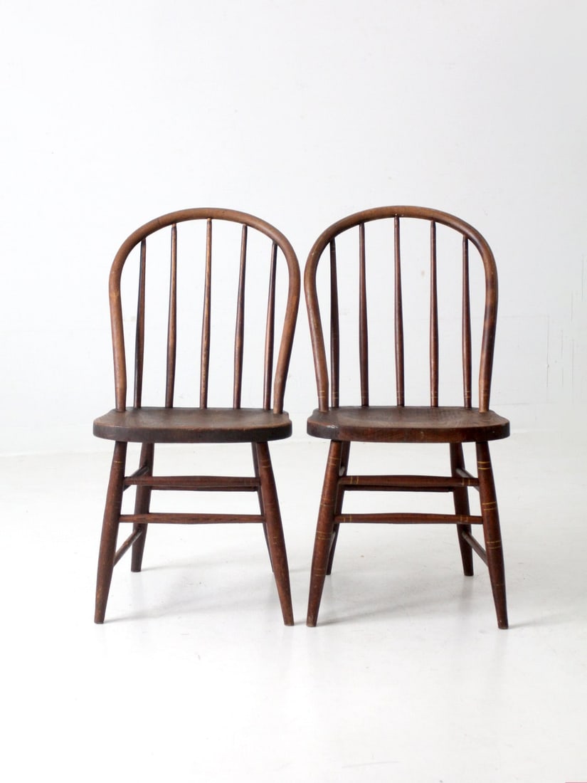 Pair of Antique Windsor Style Dining Chairs with Yellow Details: Pair of Antique Windsor Style Dining Chairs with Yellow Details This pair of antique wood dining chairs, crafted by the Northwestern Manufacturing Company of Fort Atkinson, WI, showcases the classic W