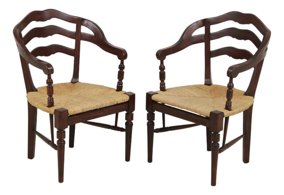 Pair of Mahogany Ladder Back Armchairs with Rush Seats: Pair of Mahogany Ladder Back Armchairs with Rush Seats Pair of barrel back chairs with rush seats and mahogany construction. These chairs feature a ladder back stretcher base frame and retain their or