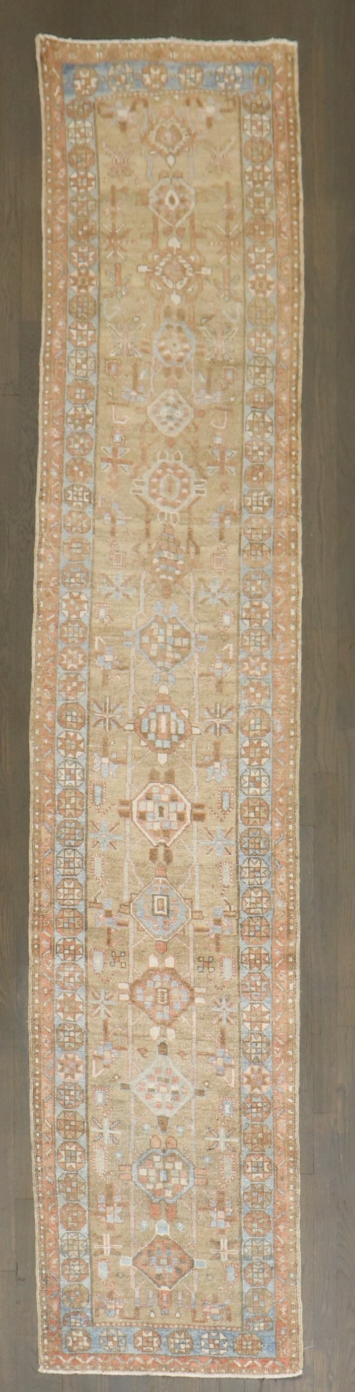 2' 2" x 10' 7" Persian Bakshaish Serapi Runner: 2' 2" x 10' 7" Persian Bakshaish Serapi Runner Early 20th-century Persian Heriz runner with a soft camel-toned color palette. This pre-owned narrow runner is identified as Bakshaish, Serapi/Heriz and 