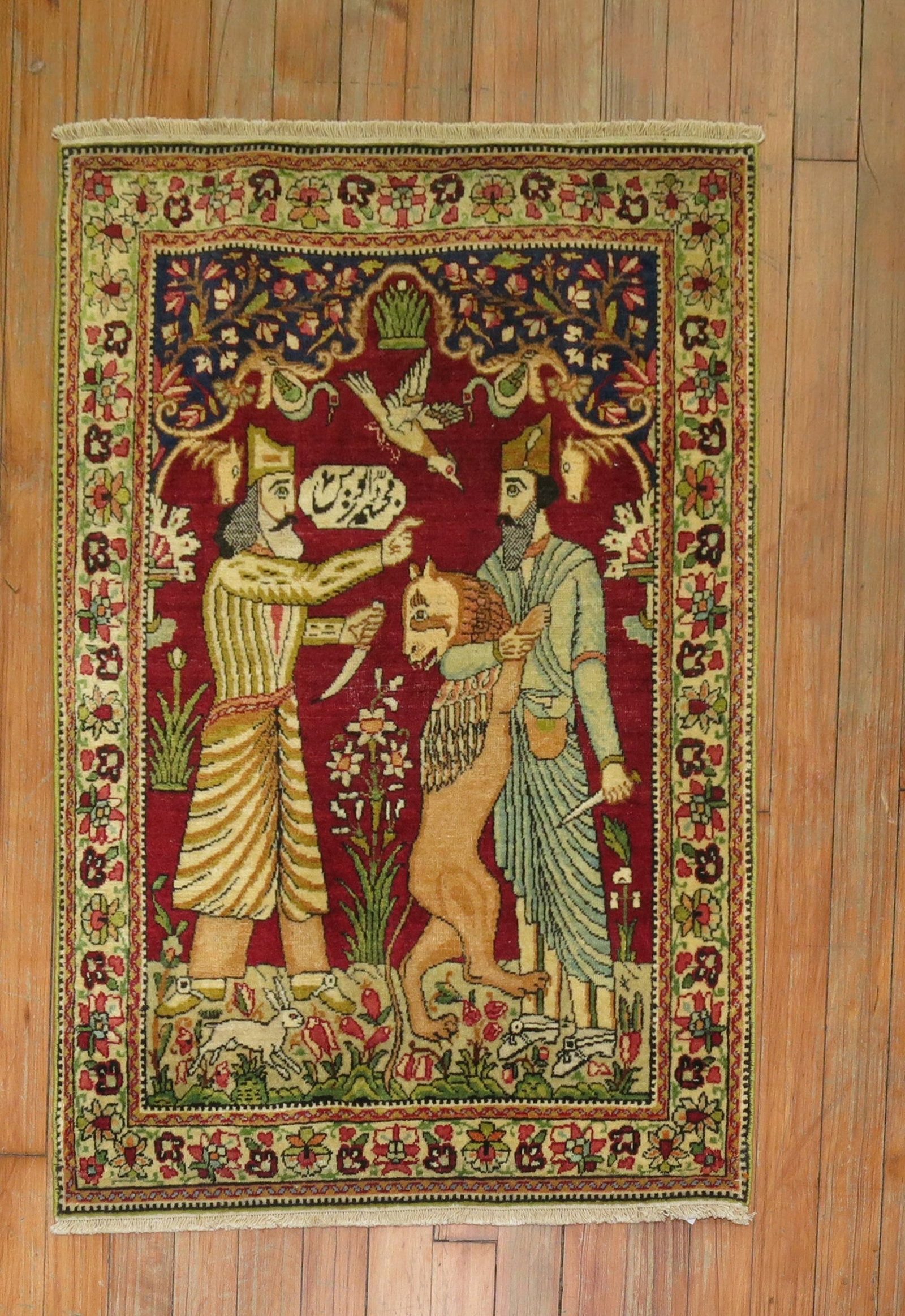 2' x 2' 11" Persian Lavar Kerman pictorial Yastik rug: 2' x 2' 11" Persian Lavar Kerman pictorial Yastik rug Early 20th century Persian Lavar Kerman pictorial rug featuring two emperors in a narrative scene, surrounded by a bird and rabbit on a cranberry 