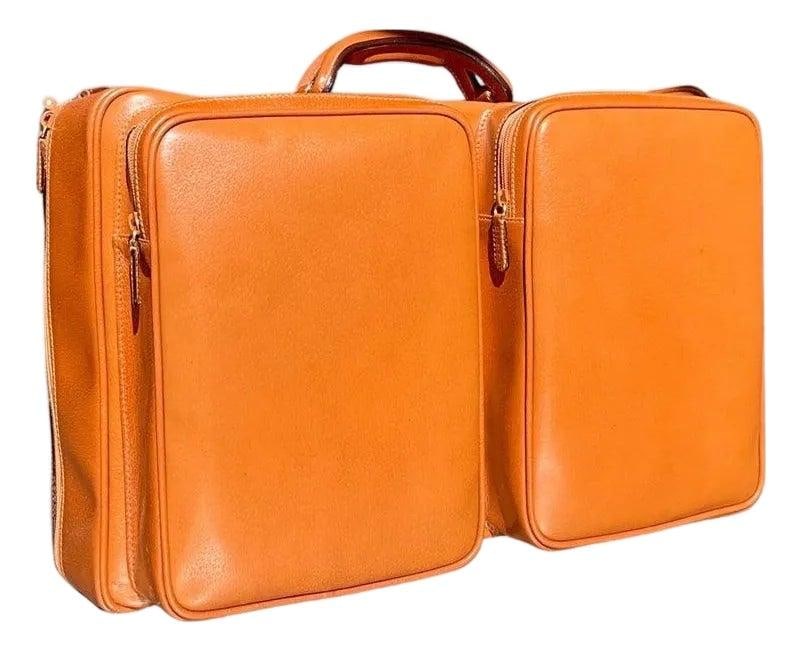 Vintage Gucci Leather Travel Bag with Original Box Burnt Orange: Vintage Gucci Leather Travel Bag with Original Box Burnt Orange This vintage Gucci leather travel bag, complete with its original box, epitomizes luxury and practicality. Crafted by the renowned Itali