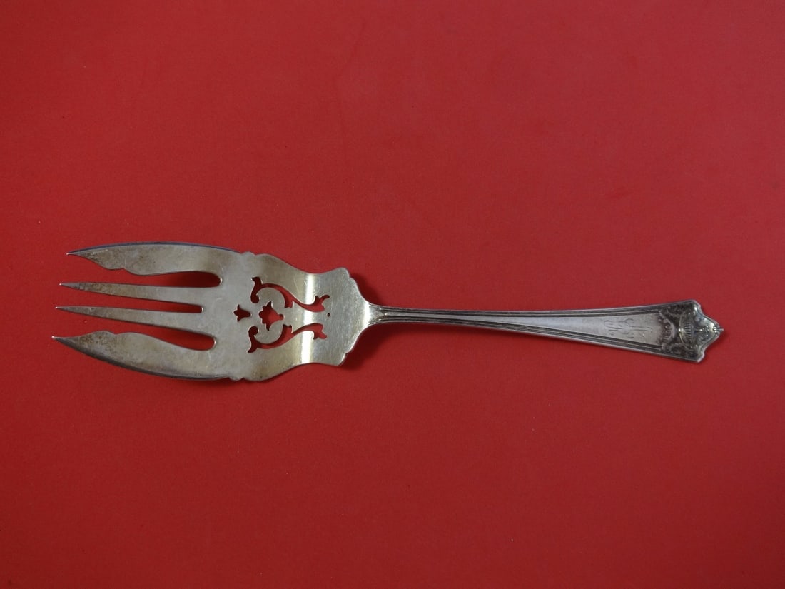 Whiting Pompeian Sterling Silver Pierced Buffet Fork 9 1/8": Whiting Pompeian Sterling Silver Pierced Buffet Fork 9 1/8" This exquisite buffet fork from the Pompeian pattern by Whiting is crafted from high-quality sterling silver. Measuring 9 1/8 inches, this s