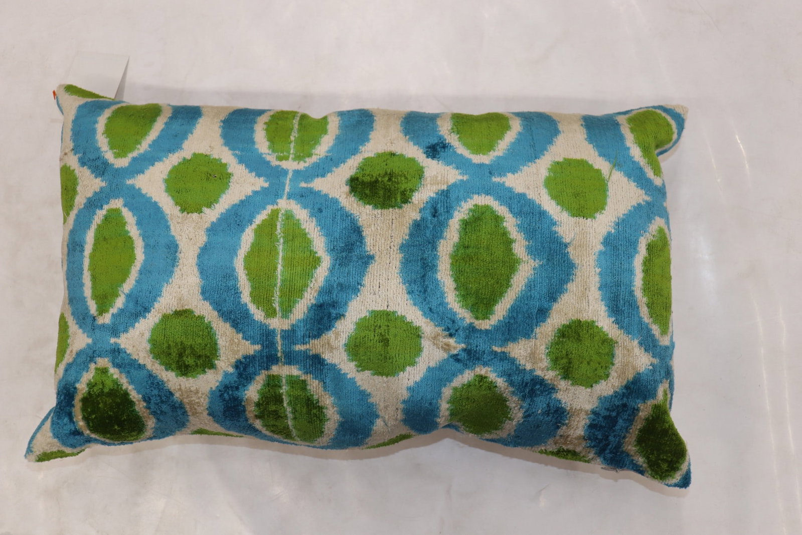 Silk Lumbar Ikat Pillow 1' 2" x 1' 11": Silk Lumbar Ikat Pillow 1' 2" x 1' 11" Pre-owned silk ikat lumbar pillow with a decorative rectangular form. The design features a geometric ikat pattern, making it a distinctive accent piece for a so