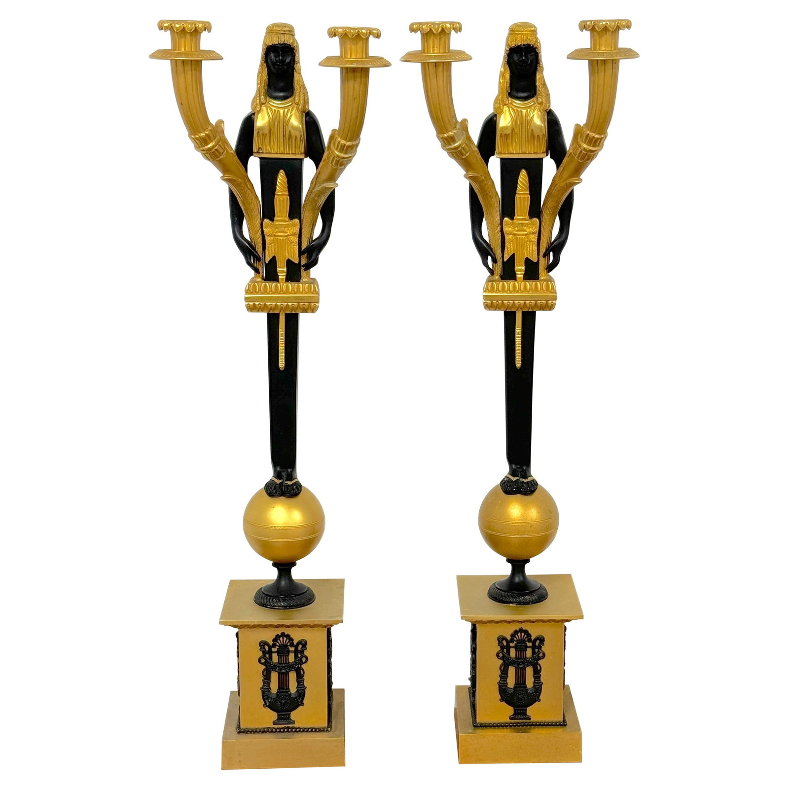 Set of 2 Empire Style Ormolu Bronze Egyptian Caryatid Two-Light Candelabra: Set of 2 Empire Style Ormolu Bronze Egyptian Caryatid Two-Light Candelabra This pair of Empire-style Egyptian caryatid two-light candelabra was crafted in France in the 20th century. Each candelabrum 