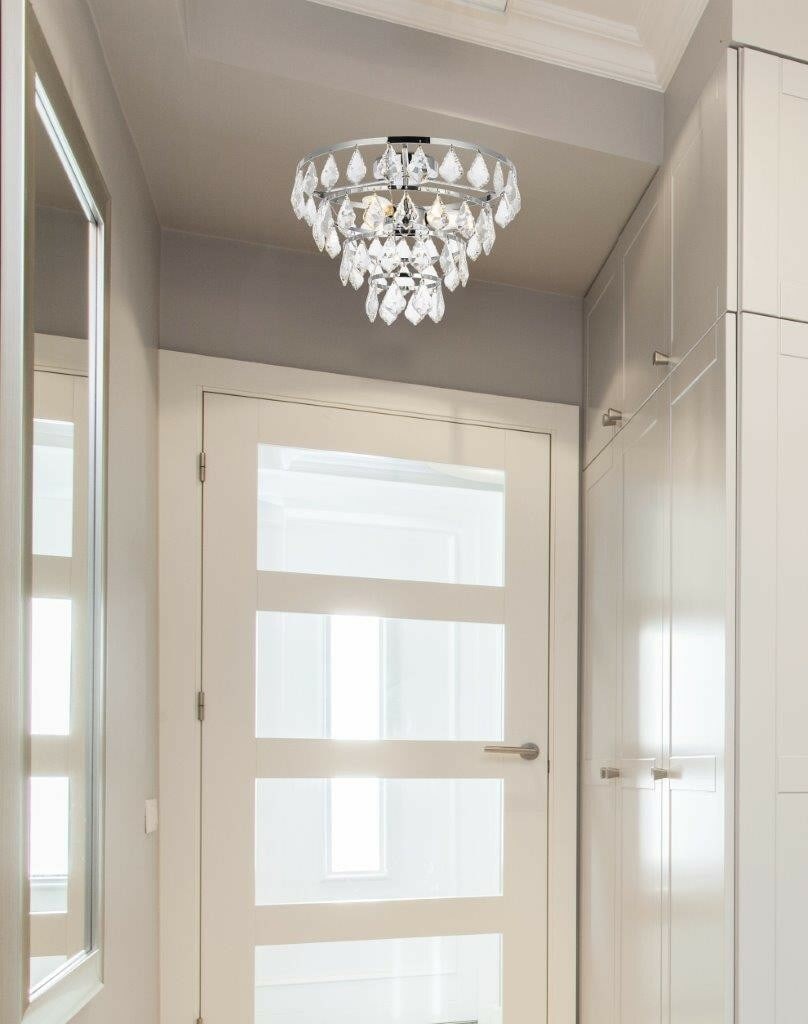 Living District Ella Chrome Crystal 3 Light Flush Mount Chandelier: Living District Ella Chrome Crystal 3 Light Flush Mount Chandelier This modern flush mount chandelier features a polished chrome finish and elegant royal cut clear crystal pendant drops. Designed for 