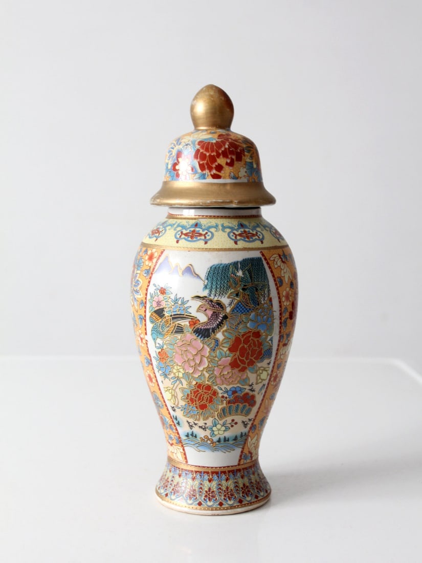 12 inch Lidded Chinese Porcelain Baluster Vase Famille Rose Style: 12 inch Lidded Chinese Porcelain Baluster Vase Famille Rose Style Vintage Chinese porcelain ginger jar with a baluster form and Famille Rose-style decoration. Colorful birds and peonies are framed by 