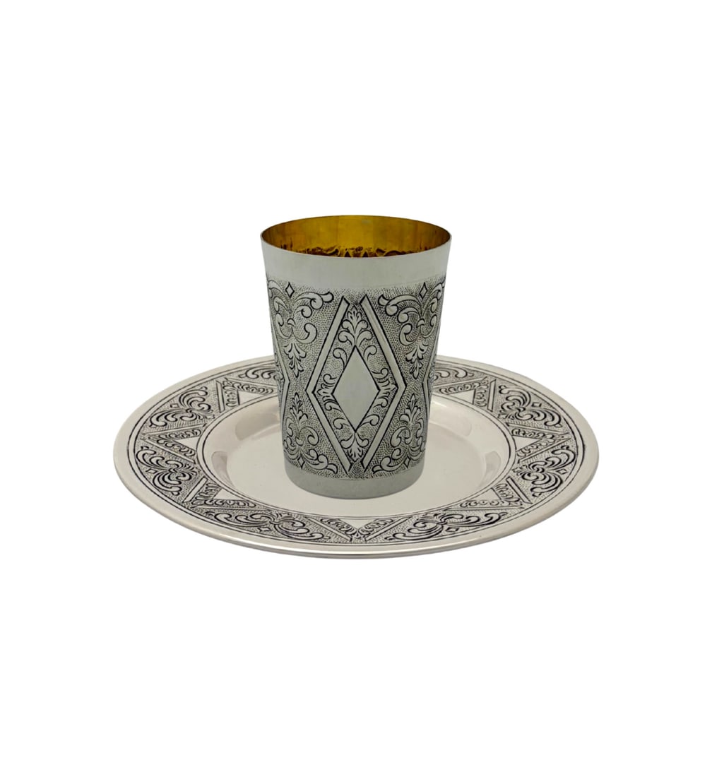 Handmade Turkish 925 Sterling Silver Cup and Tray Set: Handmade Turkish 925 Sterling Silver Cup and Tray Set A pre-owned handmade sterling silver cup and tray set featuring chased swirl ornate detailing with a matte and shiny finish. Crafted in Turkey, th
