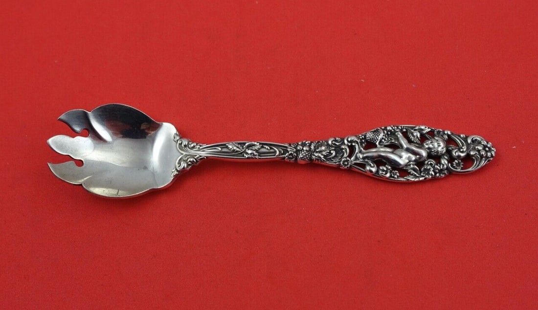 Dominick & Haff Labors of Cupid Sterling Silver Ice Cream Fork: Dominick & Haff Labors of Cupid Sterling Silver Ice Cream Fork Introducing the exquisite Labors of Cupid Ice Cream Fork by Dominick and Haff, a stunning example of Art Nouveau craftsmanship. This ster