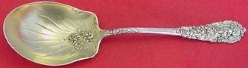 Reed & Barton Trajan Sterling Silver Gold Washed Berry Spoon 8": Reed & Barton Trajan Sterling Silver Gold Washed Berry Spoon 8" Introducing the Trajan Berry Spoon by Reed & Barton, an exquisite serving piece crafted from sterling silver with a beautiful gold wash 