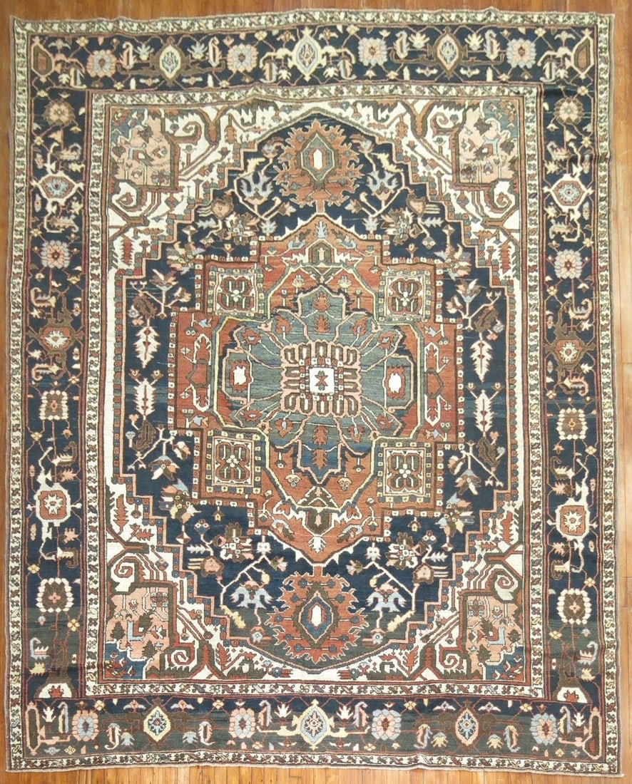 9' 9" x 12' 5" Persian Serapi Heriz Room Rug: 9' 9" x 12' 5" Persian Serapi Heriz Room Rug Early 20th century Persian Heriz rug in brown and cream tones. Identified as a Serapi/Heriz room-size rug with pre-owned condition. Specifications Type: Se