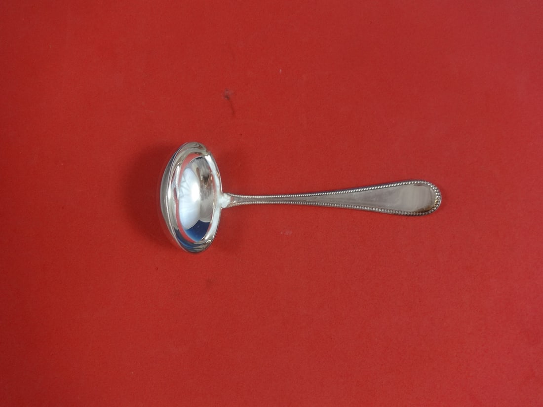 Ricci Donatello Pattern Sterling Silver Gravy Ladle 5 7/8" Unused: Ricci Donatello Pattern Sterling Silver Gravy Ladle 5 7/8" Unused Introducing the exquisite Ricci Sterling Silver Gravy Ladle, measuring 5 7/8". This stunning piece features the elegant Donatello patt