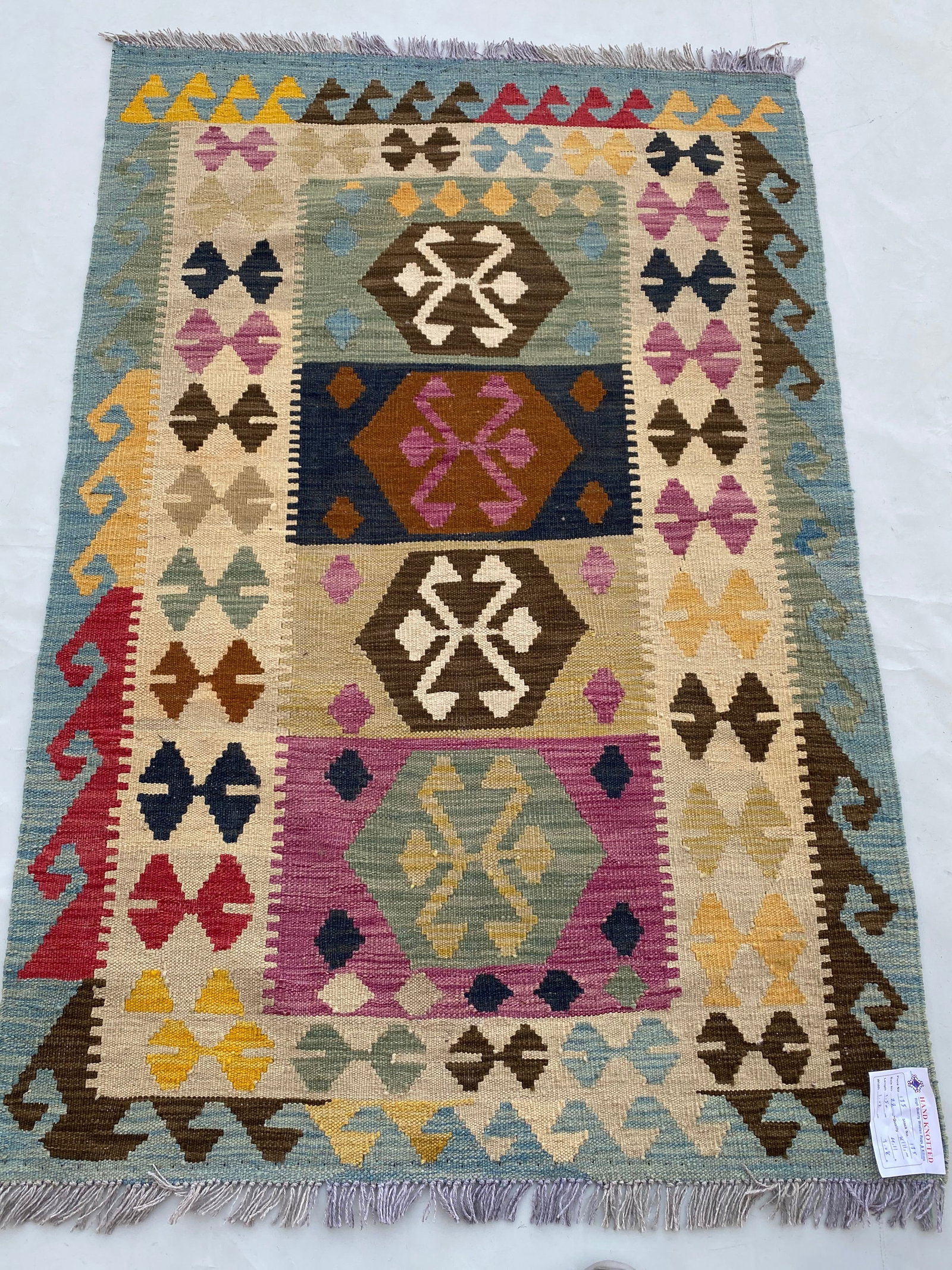 4x5 Red Multi-Color Handmade Tribal Kilim Rug from Afghanistan: 4x5 Red Multi-Color Handmade Tribal Kilim Rug from Afghanistan Free continental US Shipping Introduce vibrant flair to your space with this 4' x 5' Multi-Color Red Handmade Tribal Style Kilim Rug. Thi