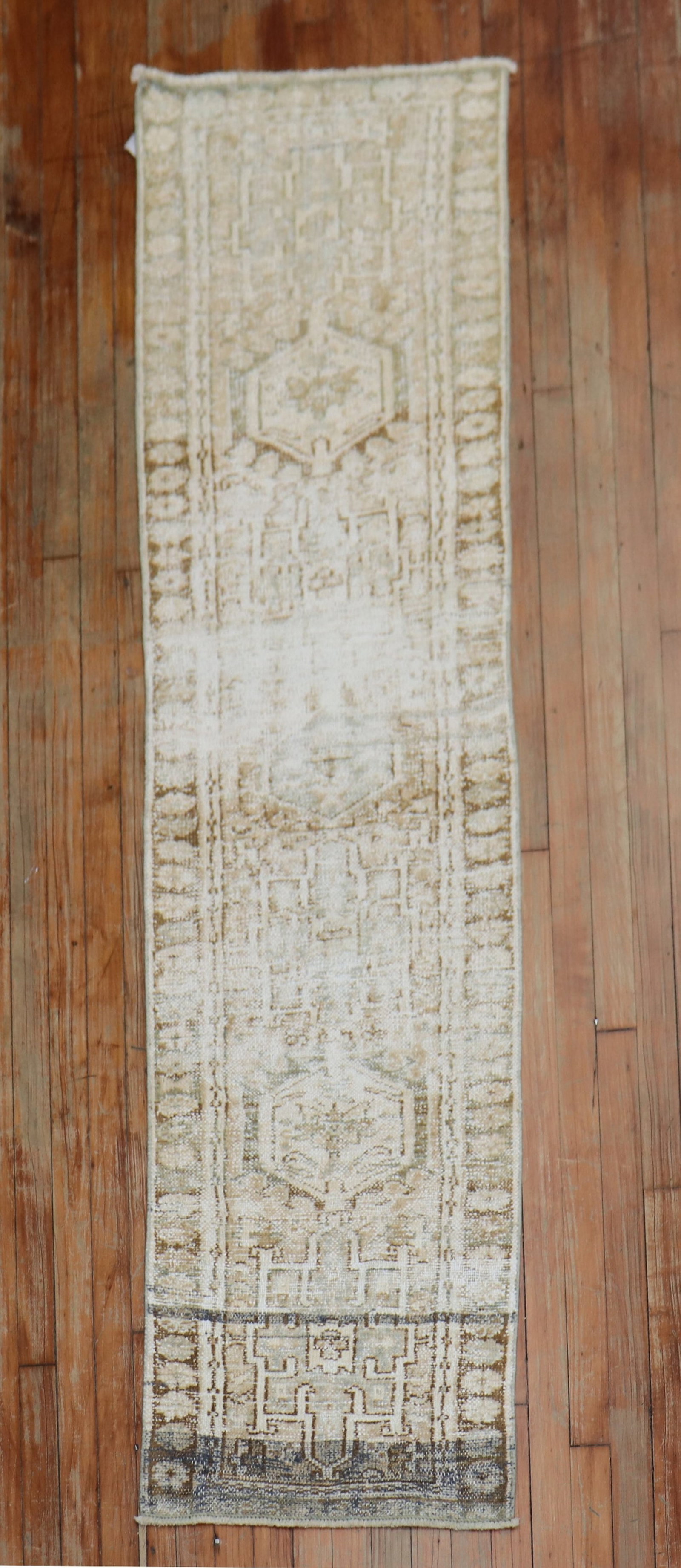 1' 10" x 7' 7" Persian Heriz Runner Neutral Geometric Rug: 1' 10" x 7' 7" Persian Heriz Runner Neutral Geometric Rug One-of-a-kind Persian Heriz runner featuring a distressed finish in neutral tones and a classic traditional geometric design. This 20th centur