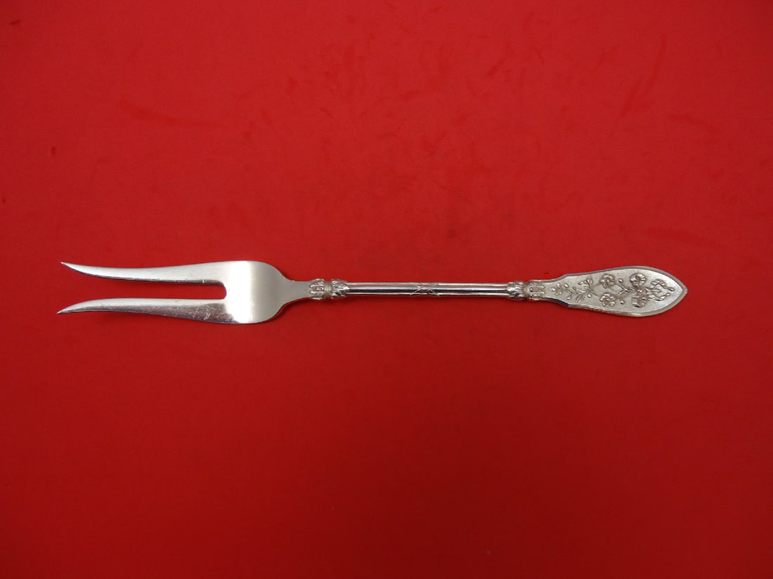Henin & Cie Grand Cru Sterling Silver Serving Fork 2-Tine 9 3/4": Henin & Cie Grand Cru Sterling Silver Serving Fork 2-Tine 9 3/4" Elevate your dining experience with this exquisite Grand Cru serving fork from Henin & Cie. Crafted from high-quality sterling silver, 