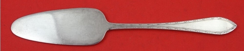 Tiffany & Co Feather Edge Sterling Silver Cheese Server 7 Inch: Tiffany & Co Feather Edge Sterling Silver Cheese Server 7 Inch This exquisite cheese server from Tiffany & Co. features the elegant Feather Edge pattern and is crafted from high-quality sterling silve