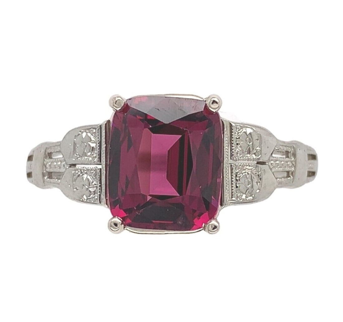 Cushion Garnet Vintage 18k White Gold Ring 3.02ct Size 8.5 Raspberry Color: Cushion Garnet Vintage 18k White Gold Ring 3.02ct Size 8.5 Raspberry Color This vintage ring features a genuine natural raspberry-colored garnet in an antique cushion cut, weighing 3.02 carats. The ga
