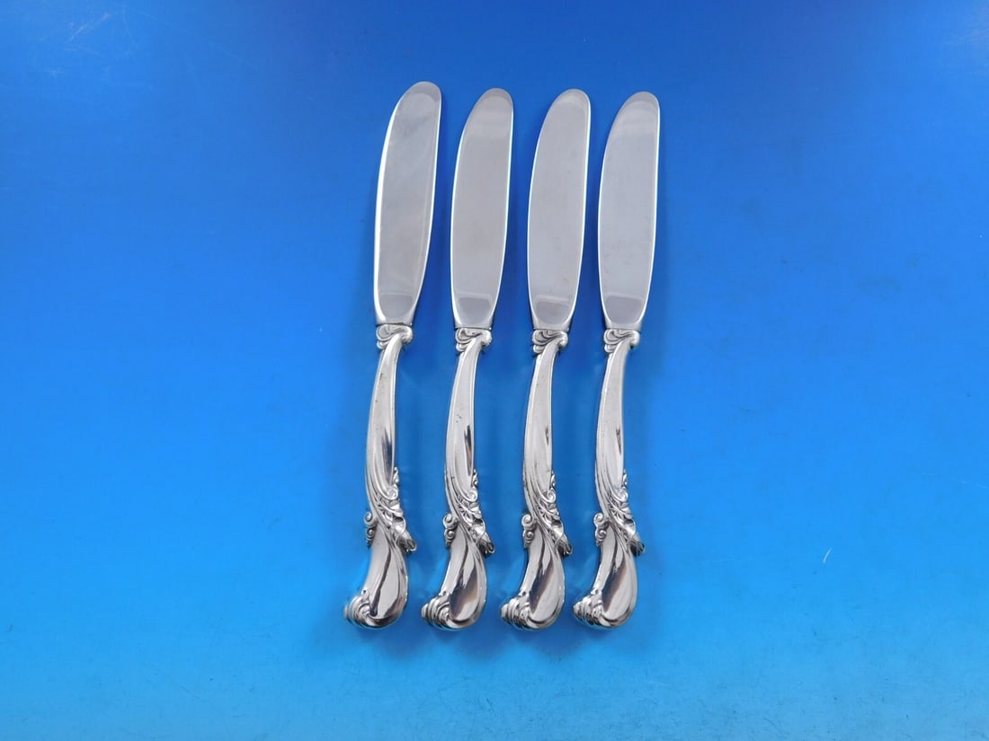 Wallace Waltz of Spring Sterling Silver Butter Spreaders Set of 4: Wallace Waltz of Spring Sterling Silver Butter Spreaders Set of 4 This exquisite set of four butter spreaders features the elegant Waltz of Spring pattern by Wallace. Each spreader is crafted with a s