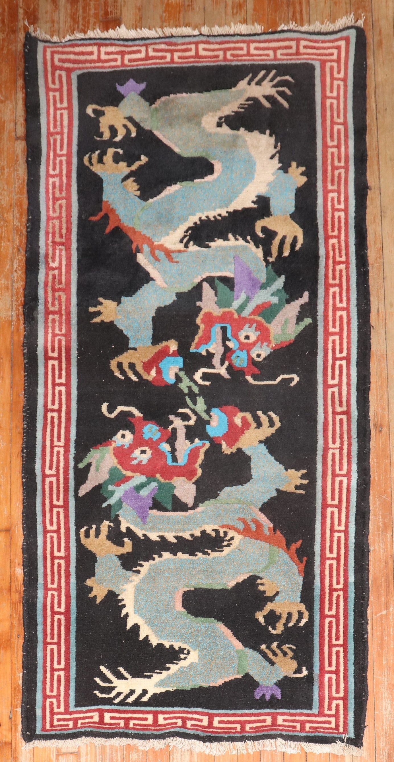 3' x 6' 3" Tibetan Pictorial Dragon Runner Rug: 3' x 6' 3" Tibetan Pictorial Dragon Runner Rug Vintage Tibetan small runner with a pictorial dragon motif and geometric border. This late 20th century rug is pre-owned. Specifications Type: Pictorial,