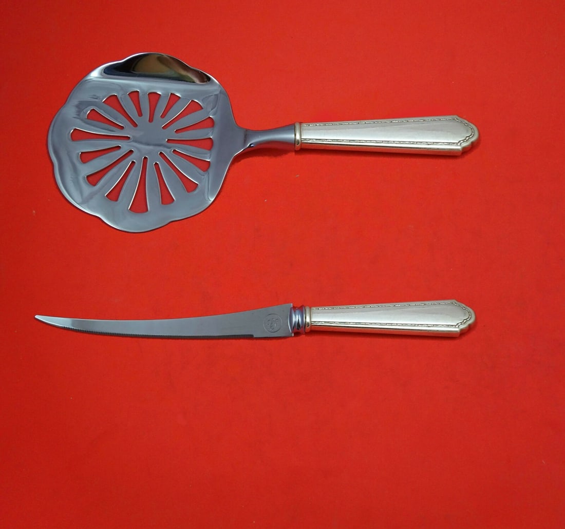Lunt William and Mary Sterling Silver Tomato Serving Set 2 Pieces: Lunt William and Mary Sterling Silver Tomato Serving Set 2 Pieces This is a two-piece sterling silver tomato serving set by Lunt, featuring the William and Mary pattern. The set includes an 8-inch tom