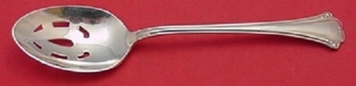 Reed and Barton English Chippendale Sterling Silver Slotted Spoon 8 3/4": Reed and Barton English Chippendale Sterling Silver Slotted Spoon 8 3/4" This exquisite slotted serving spoon showcases the timeless English Chippendale pattern by Reed and Barton. Crafted from high-q