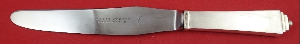 Sterling Silver Pyramid Pattern Dinner Knife with GI Mark 9 5/8 Inch: Sterling Silver Pyramid Pattern Dinner Knife with GI Mark 9 5/8 Inch This is a Georg Jensen Pyramid pattern dinner knife featuring a sterling silver hollow short handle and a stainless steel blade wit