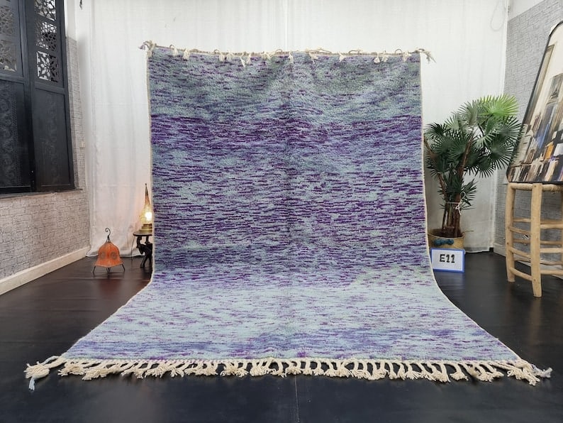 Authentic Handmade Wool Rug 9.84 x 6.56 Feet from Morocco: Authentic Handmade Wool Rug 9.84 x 6.56 Feet from Morocco Experience the elegance and luxury of this authentic, soft handmade wool rug, meticulously handwoven in the Atlas Mountains by skilled local B