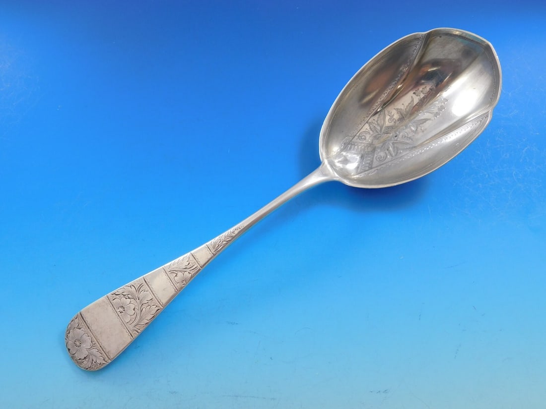 Durgin Vintage Sterling Silver Brite-Cut Fluted Berry Spoon 9 3/4": Durgin Vintage Sterling Silver Brite-Cut Fluted Berry Spoon 9 3/4" This exquisite vintage berry spoon from Durgin features a beautiful fluted design and is crafted from high-quality sterling silver. M