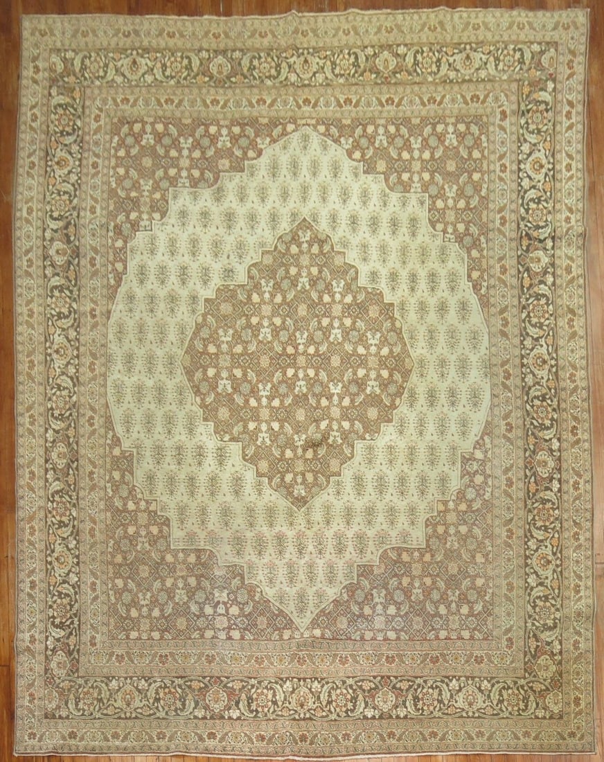 9' 1" x 12' 11" Early 20th Century Persian Tabriz Room Rug: 9' 1" x 12' 11" Early 20th Century Persian Tabriz Room Rug Early 20th century Persian Tabriz room-size rug with a classic decorative design. Offered in pre-owned condition. Specifications Type: Tabriz