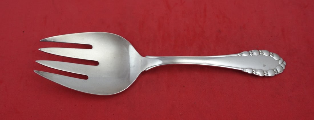 Georg Jensen Lily of the Valley Sterling Salad Serving Fork 8 5/8": Georg Jensen Lily of the Valley Sterling Salad Serving Fork 8 5/8" Enhance your dining experience with this exquisite Sterling Silver Salad Serving Fork from the renowned Lily of the Valley pattern by