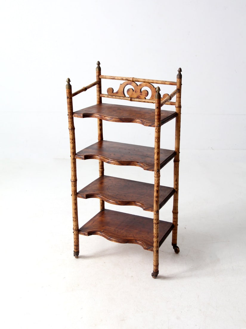 Vintage 19th Century Bamboo Etagere with Brass Finials: Vintage 19th Century Bamboo Etagere with Brass Finials This antique bamboo etagere shelf is a stunning piece that combines warmth and character, featuring four scalloped-edge wooden shelves. The natur