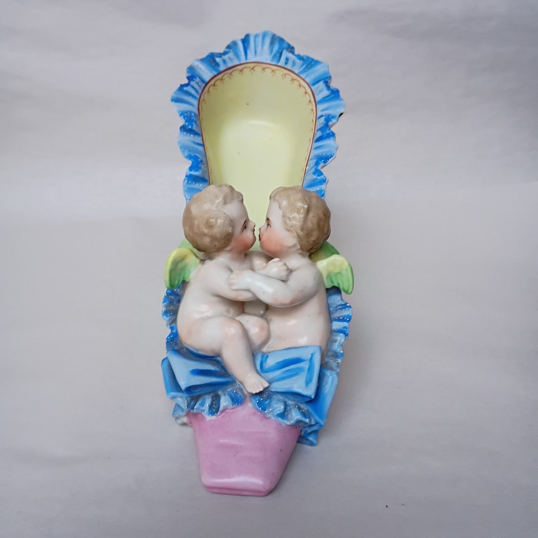 Victorian porcelain slipper with cherub figures French art pottery: Victorian porcelain slipper with cherub figures French art pottery Antique porcelain shoe slipper featuring a pair of kissing cherubs or putti. This Victorian-era decorative object is described as Fre