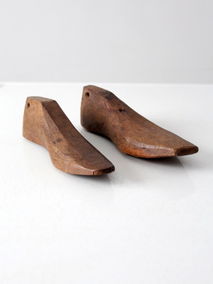 Antique Folk Art Wooden Cobblers Shoe Lasts His and Hers Set: Antique Folk Art Wooden Cobblers Shoe Lasts His and Hers Set Discover this charming pair of antique folk art cobbler's shoe lasts, hand-crafted from wood. This unique "his and hers" set features holes