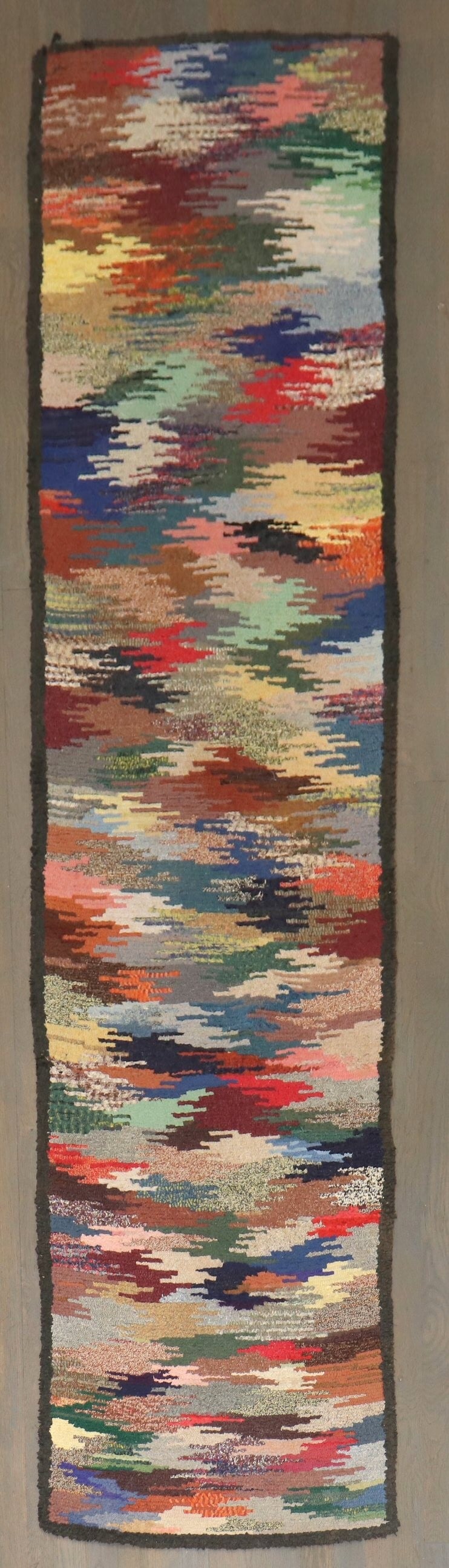2' 2" x 9' American Hooked Rug Runner: 2' 2" x 9' American Hooked Rug Runner Early 20th century American hooked runner with a narrow profile. This pre-owned runner is categorized as a hooked rug runner. Specifications Origin: American Peri