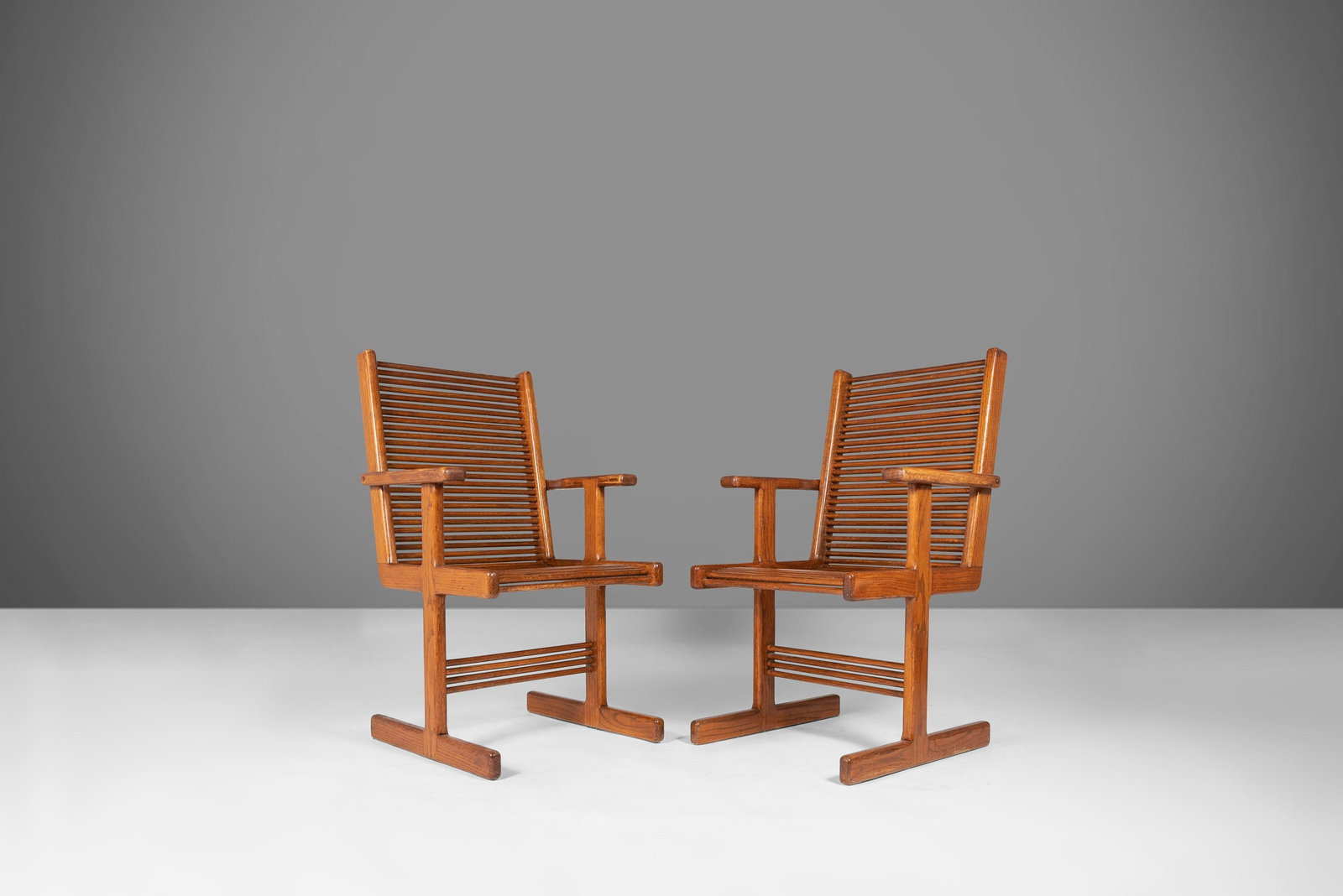 1980s Set of 2 Modern Spindle Arm Chairs After Stephen Hynson: 1980s Set of 2 Modern Spindle Arm Chairs After Stephen Hynson This set of two modern spindle arm chairs, inspired by Stephen Hynson and dating back to the 1980s, features a unique and eye-catching des