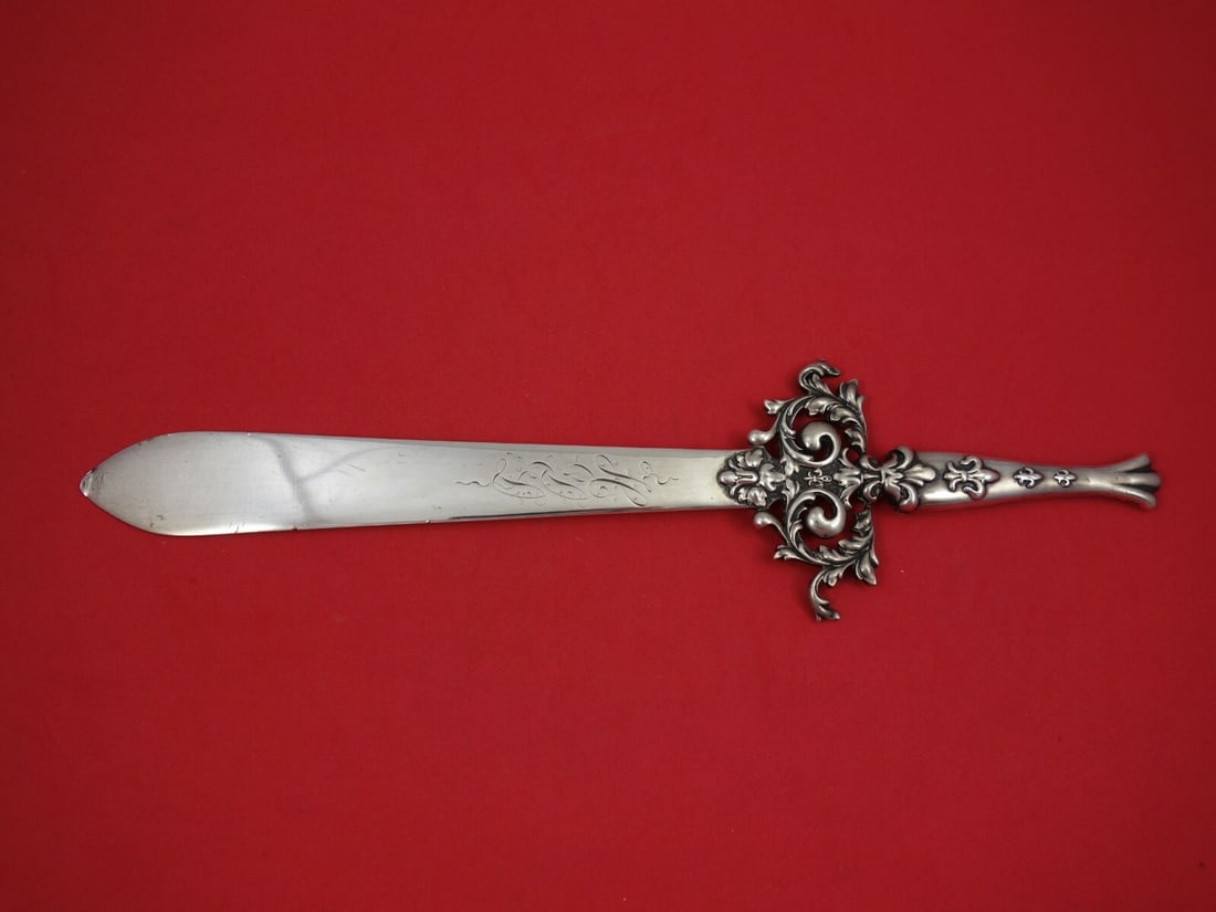 Mauser Sterling Silver Paper Knife Fleur-de-Lis 12.5 inches Retailed by T.S. Starr: Mauser Sterling Silver Paper Knife Fleur-de-Lis 12.5 inches Retailed by T.S. Starr This exquisite Mauser paper knife, crafted from all sterling silver, showcases a stunning fleur-de-lis design. Measur