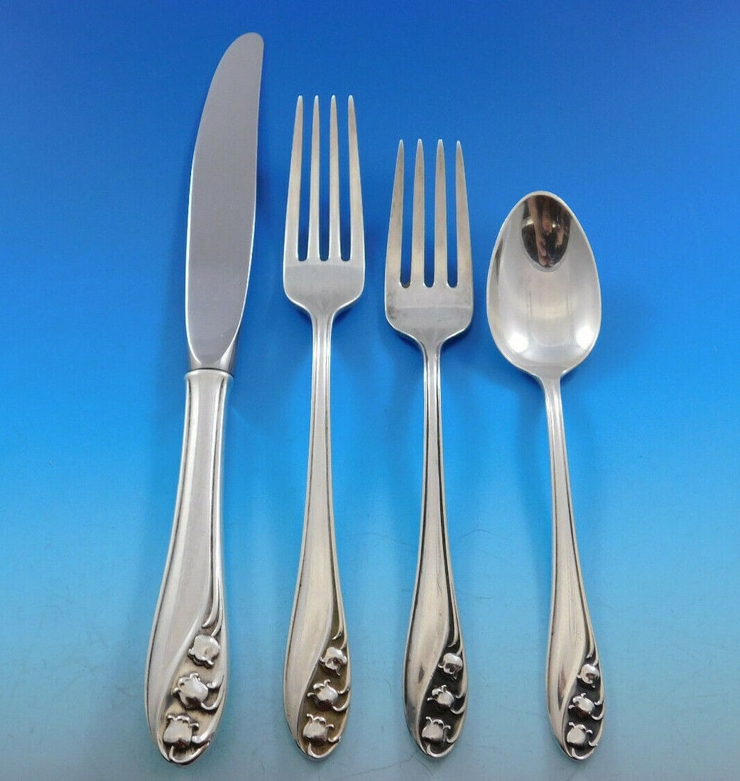 4 Piece Gorham Lily of the Valley Sterling Silver Place Setting: 4 Piece Gorham Lily of the Valley Sterling Silver Place Setting A 4-piece regular size place setting in the Lily of the Valley pattern by Gorham, crafted in sterling silver. This pre-owned set include