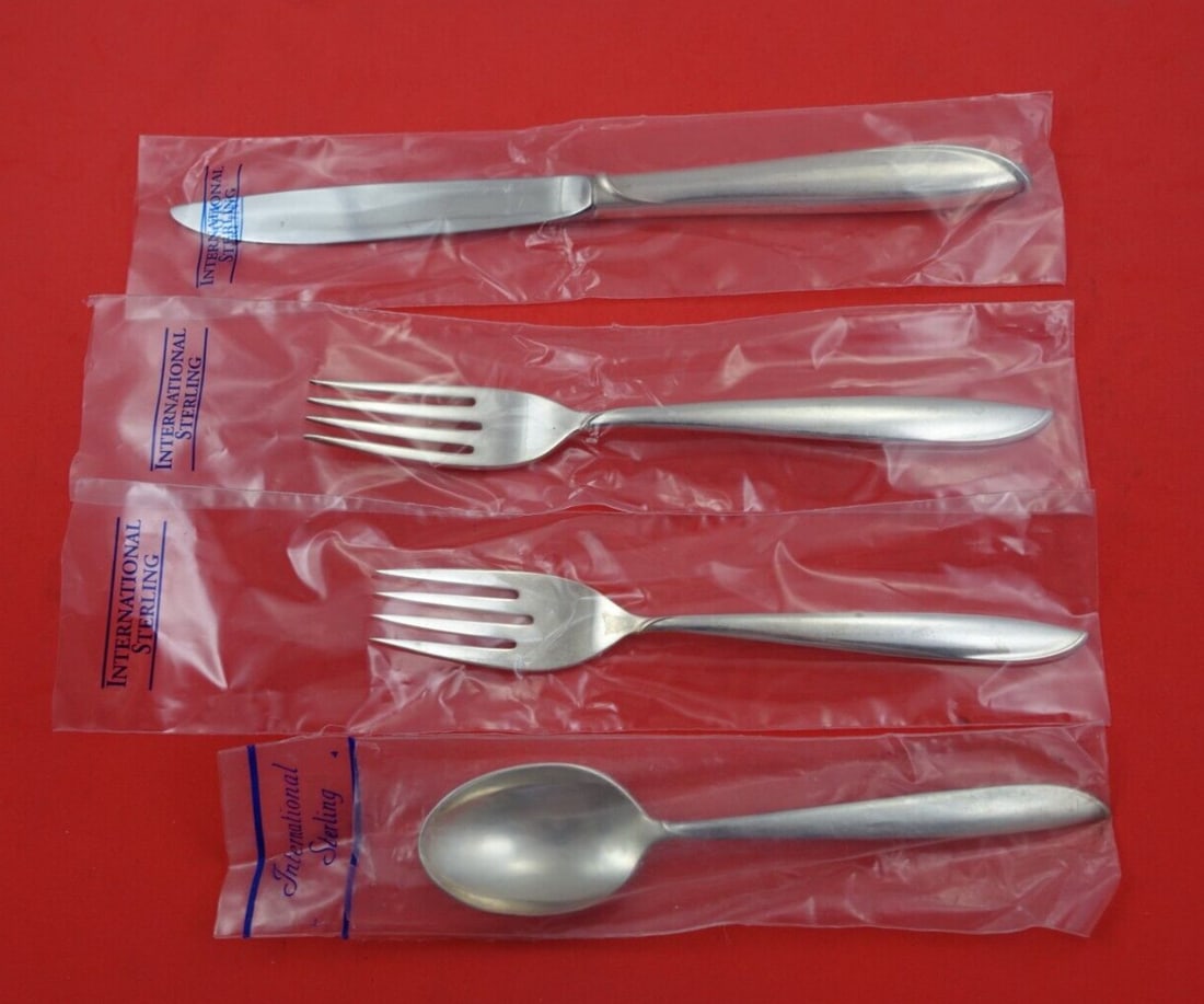 International Sterling Silver Rhythm 4-Piece Place Setting New: International Sterling Silver Rhythm 4-Piece Place Setting New Elevate your dining experience with the exquisite Silver Rhythm 4-piece place setting by International Sterling. Crafted from high-qualit