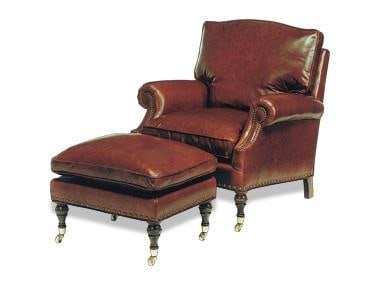 Hand-Crafted Oxblood Leather Ottoman with Kidney Pillow: Hand-Crafted Oxblood Leather Ottoman with Kidney Pillow This hand-crafted oxblood ottoman features a plush leather seat and a kidney pillow, embodying the classic English traditional style. With non-r