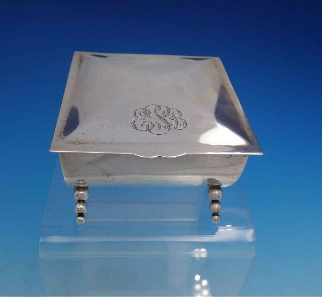 Georg Jensen USA Sterling Silver Beaded Barrel Jewelry Box #22: Georg Jensen USA Sterling Silver Beaded Barrel Jewelry Box #22 This stunning Georg Jensen USA sterling silver jewelry box features a unique barrel shape with a hinged lid and four elegantly designed b