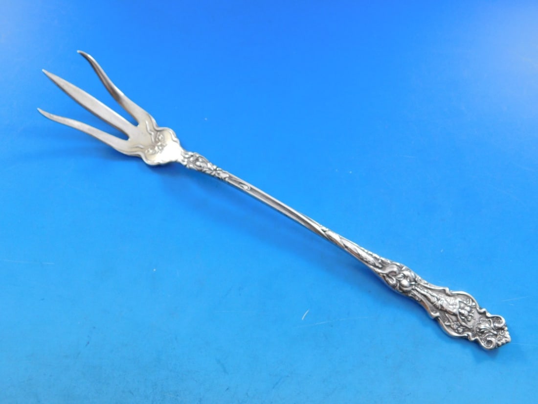 Wallace Irian Sterling Silver Lettuce Fork 8.5" Light Gold Wash: Wallace Irian Sterling Silver Lettuce Fork 8.5" Light Gold Wash This exquisite serving fork from the Irian pattern by Wallace is crafted from high-quality sterling silver and features a light gold was