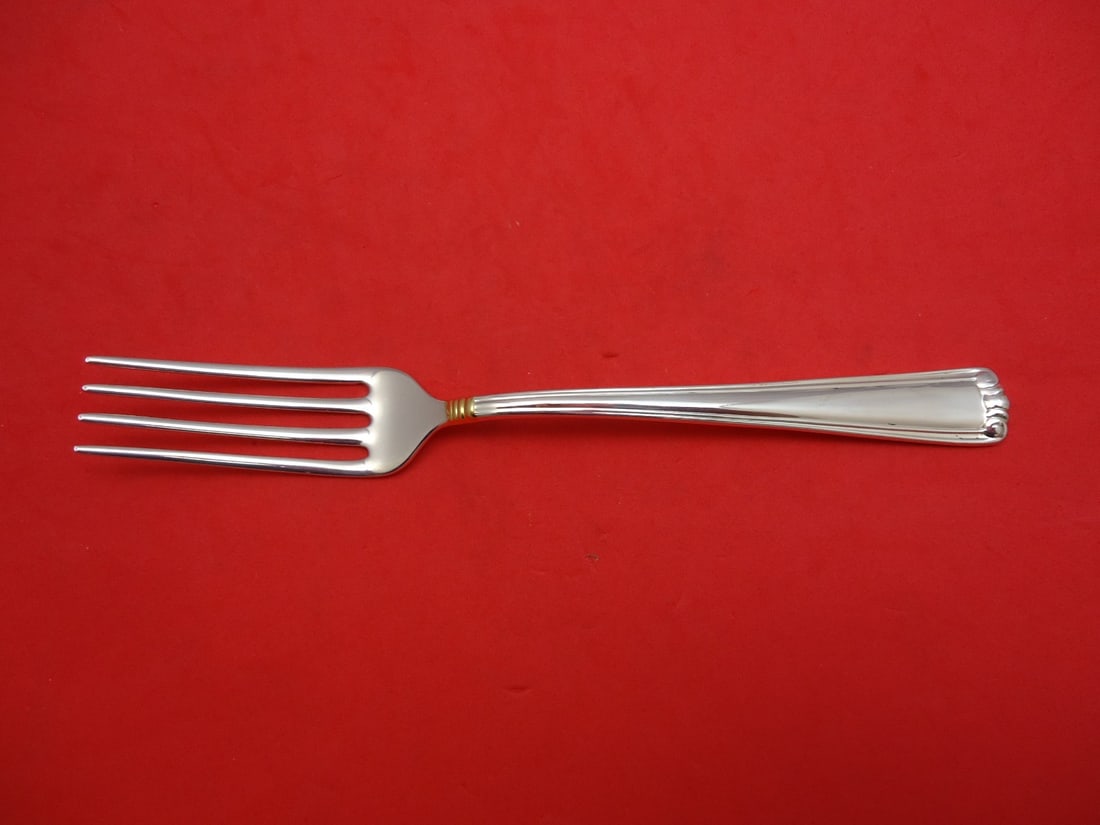 Lunt Sterling Silver Embassy Scroll Gold Dinner Fork 7 5/8": Lunt Sterling Silver Embassy Scroll Gold Dinner Fork 7 5/8" This exquisite dinner fork from the Embassy Scroll Gold pattern by Lunt is crafted from high-quality sterling silver. Measuring 7 5/8 inches