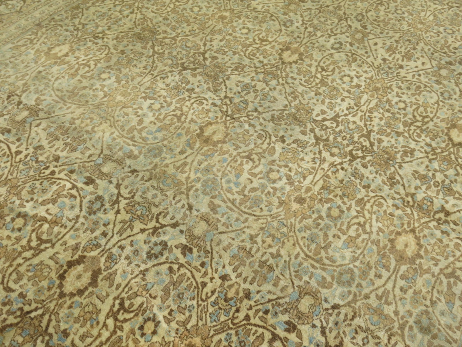 9' 2" x 12' 4" Persian Tabriz Hadji Jali-Li Room Rug: 9' 2" x 12' 4" Persian Tabriz Hadji Jali-Li Room Rug Early 20th century Persian Tabriz rug with an ivory field and soft baby blue and brown accents. This Hadji Jali-Li room-size rug is pre-owned. Spec