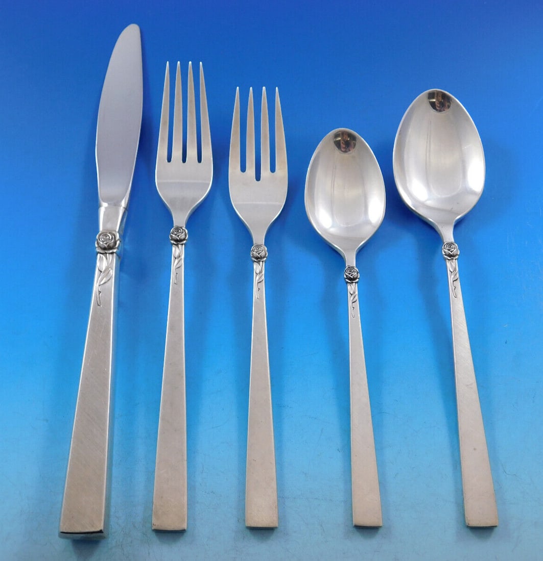 International Silver Dawn Rose 20 Piece Sterling Flatware Set with Caddy: International Silver Dawn Rose 20 Piece Sterling Flatware Set with Caddy Elevate your dining experience with the Dawn Rose flatware set by International Sterling. This exquisite 20-piece service showc