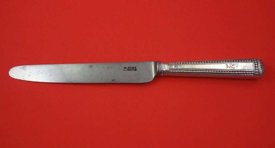 Georgian Sterling Silver Dinner Knife WS Beaded Handle 11 1/4 Inch: Georgian Sterling Silver Dinner Knife WS Beaded Handle 11 1/4 Inch This exquisite English Georgian dinner knife, crafted from sterling silver, features a beautiful beaded handle, showcasing the elegan