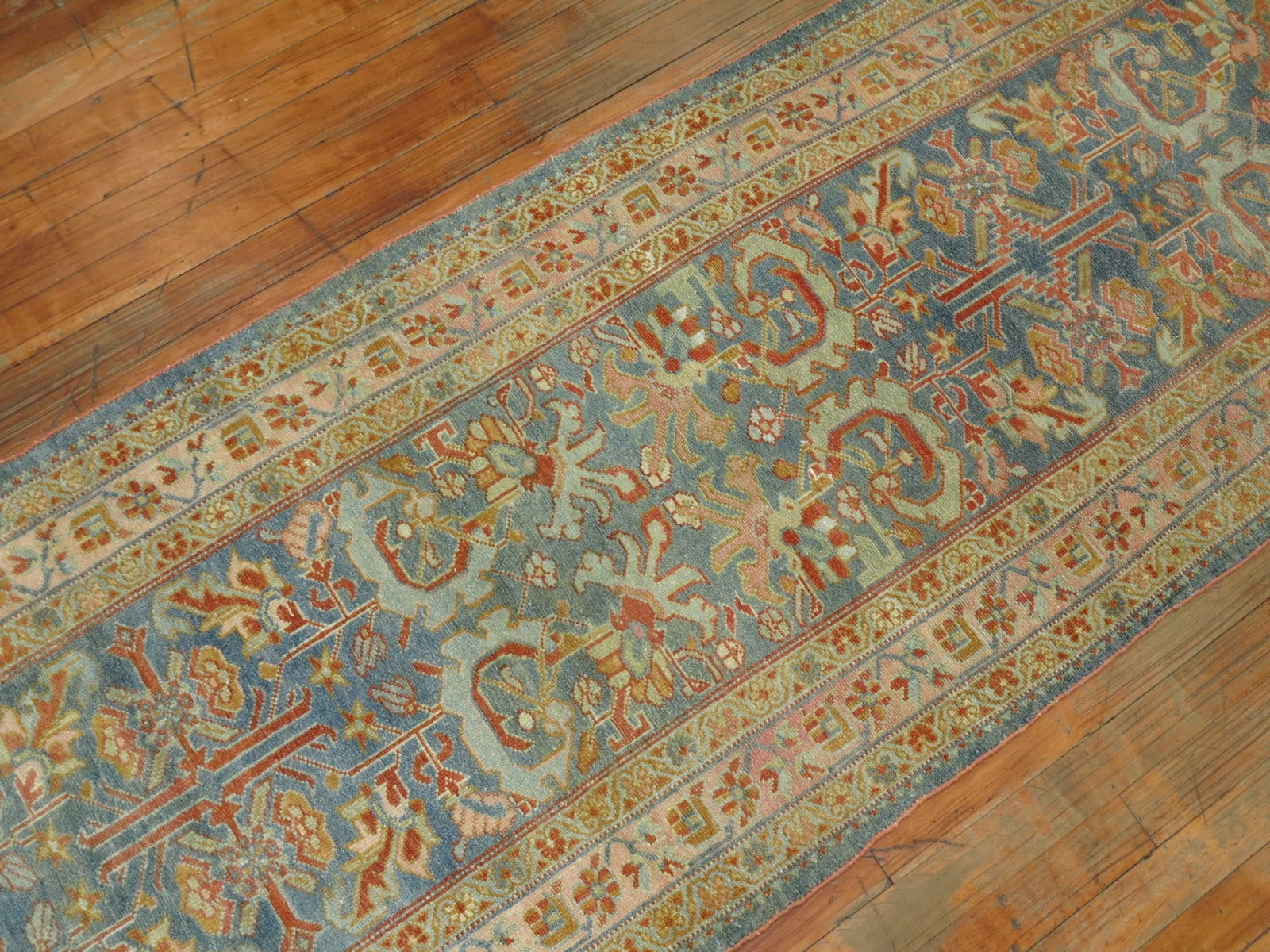 2' 5" x 18' 1" Persian Malayer runner in blue: 2' 5" x 18' 1" Persian Malayer runner in blue Early 20th century Persian Malayer runner rug featuring a blue field with pink and red accents and an intricate patterned design. This pre-owned piece is 